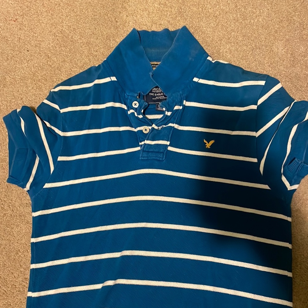 Royal blue white striped american eagle polo